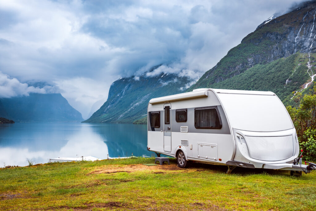 Caravan parked beside a lake