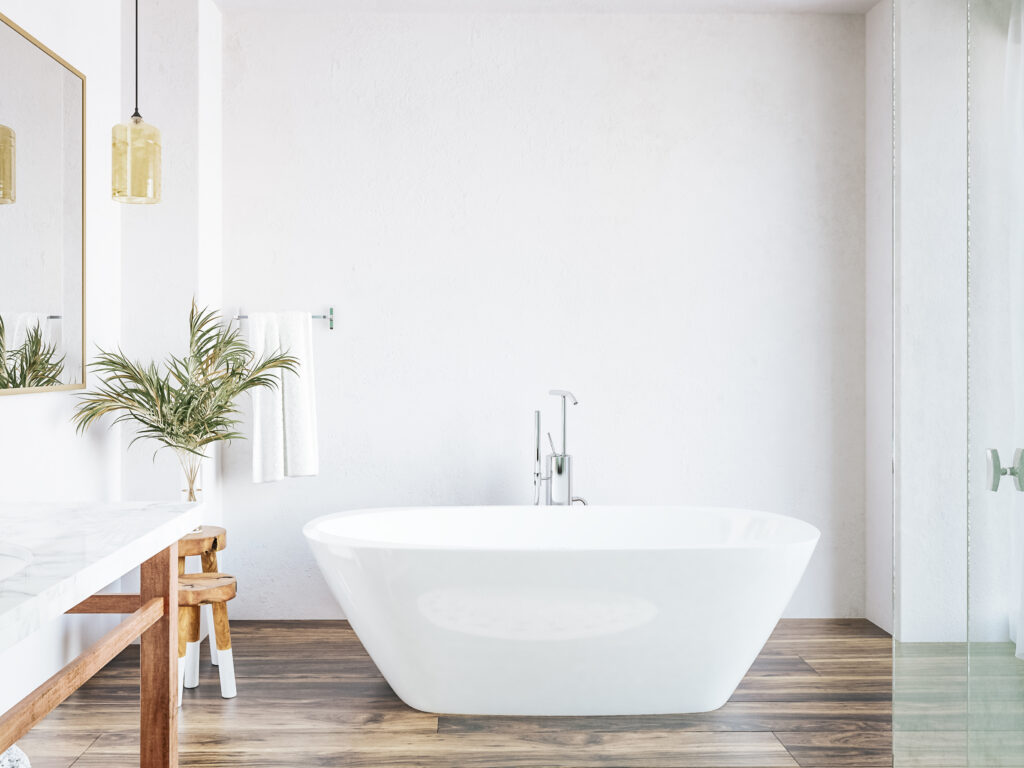 3D render of a new white bathroom with a bath as the focal point