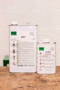 HP7 resin solution and HP2002 sealer displayed on a wooden trolley