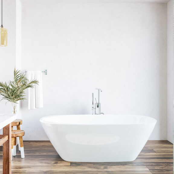 3D render of a new white bathroom with a bath as the focal point