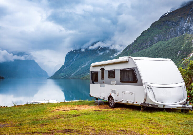 Caravan parked beside a lake