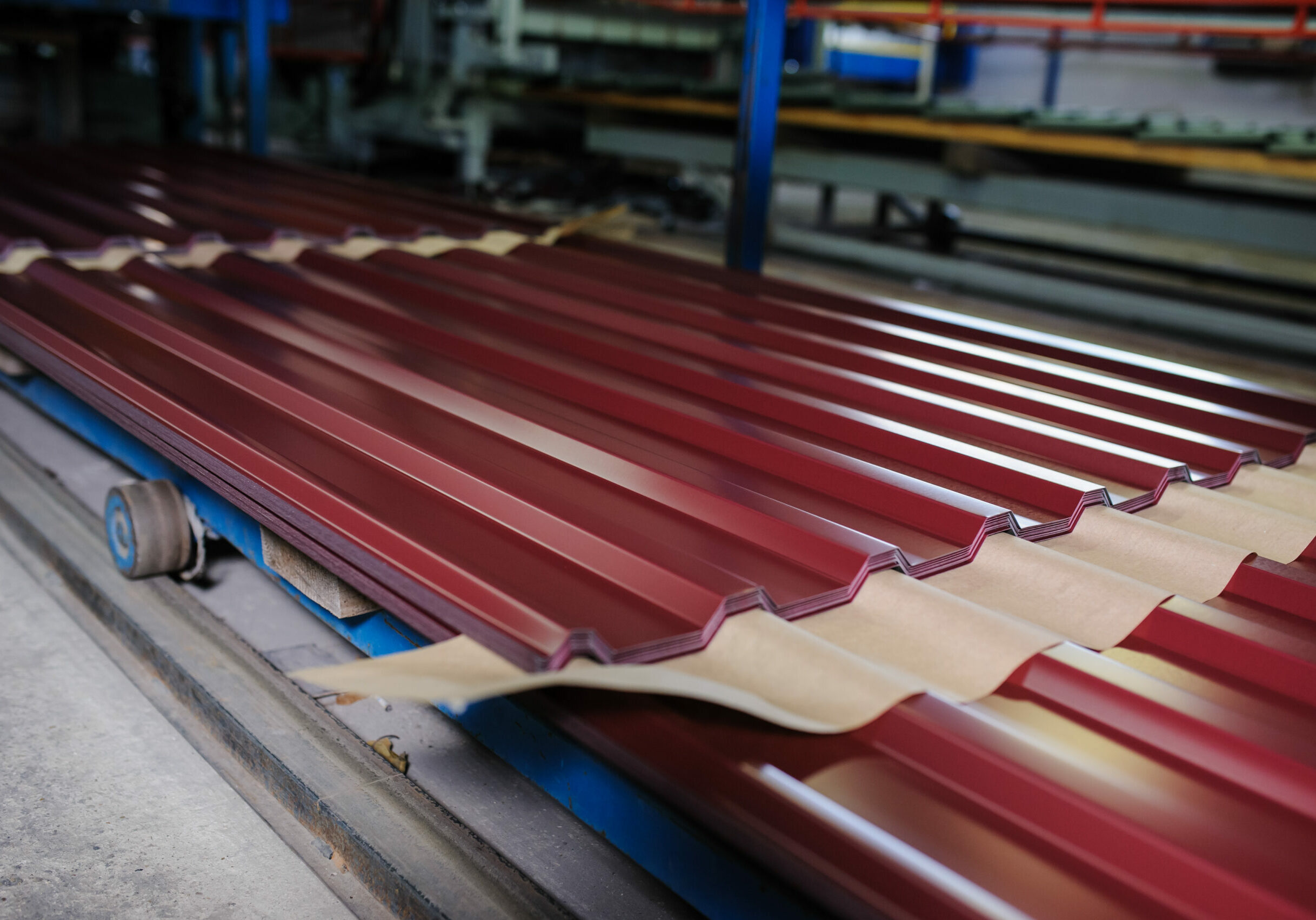 Red sheet metal formed and laid out in factory